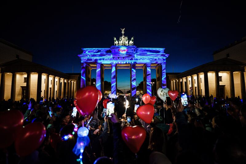 The Brandenburg Gate lit up for a light festival in Berlin, despite being partially dimmed to save energy. EPA