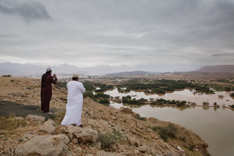 People take pictures at the Ansab Nature Reserve in Muscat, Oman after heavy rains hit the country. All photos: Tara Atkinson for The National