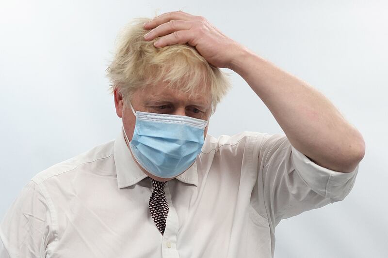British Prime Minister Boris Johnson gestures as he visits Finchley Memorial Hospital in North London on Tuesday. AFP
