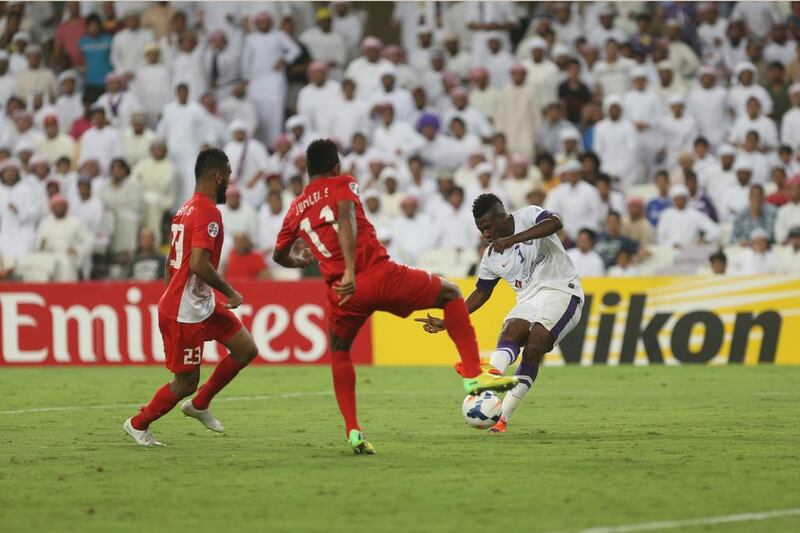 Al Ain striker Asamoah Gyan shoots to score his second, winning goal of the night in his side's Asian Champions League last-16 victory over Al Jazira. Delores Johnson / The National / May 13, 2014