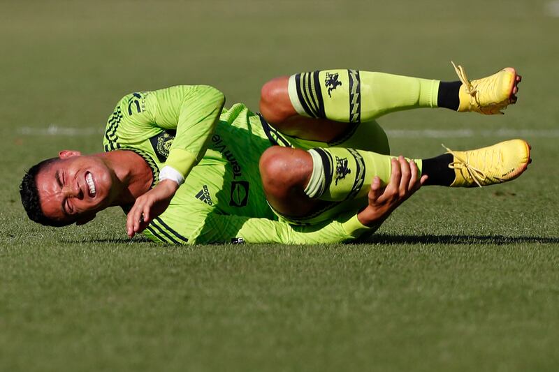 Cristiano Ronaldo suffers a knock. AFP