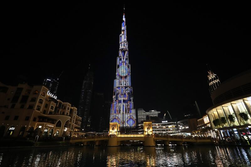 Artwork displayed on Burj Khalifa celebrating the UAE’s 50th National Day. Pawan Singh / The National.