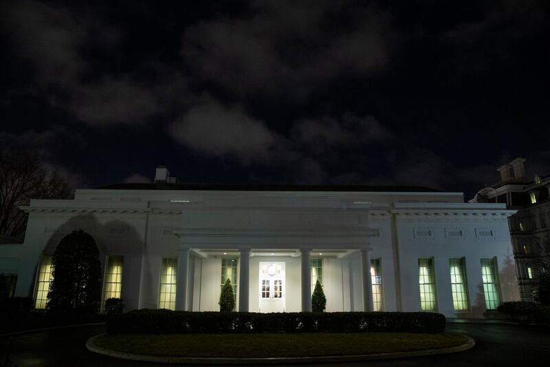 All the lights are on in the windows of the West Wing of the White House after news of a missile attack on an Iraqi air base housing US troops. AP Photo