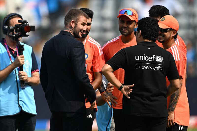 Sachin Tendulkar and David Beckham interact with Indian players. AFP