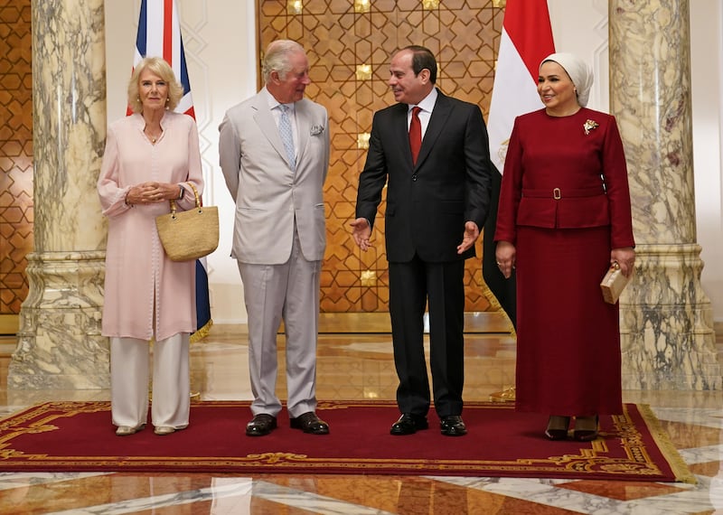 Prince Charles and Camilla, Duchess of Cornwall, wearing a pale pink Anna Valentine tunic and trousers, meet Egypt's President Abdel Fattah El Sisi and the first lady Entissar Amer, at Al-Ittihadiya Palace in Cairo on November 18, 2021. Reuters