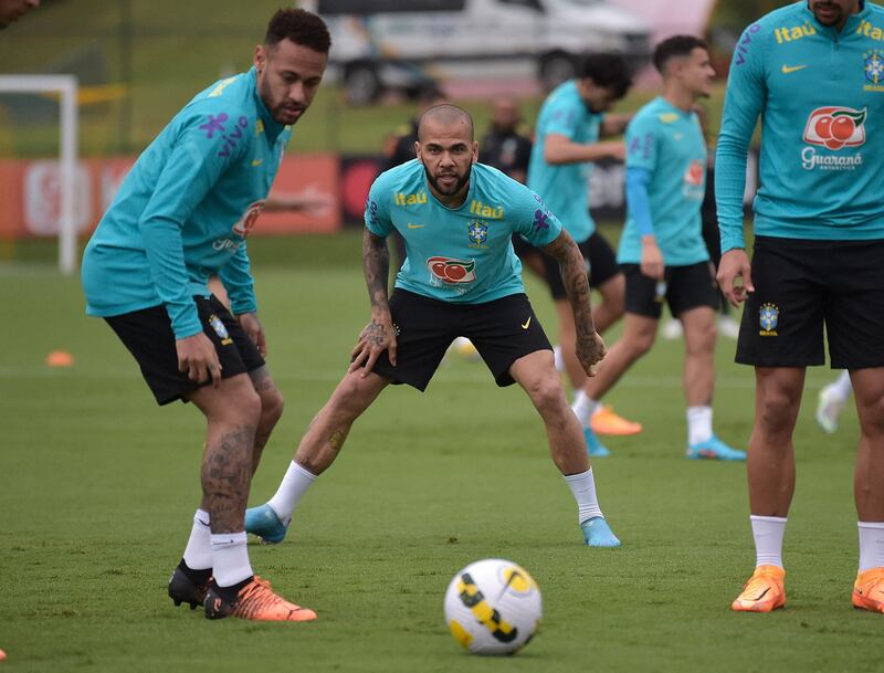 Brazil's Neymar and Dani Alves take part in a training session. AFP