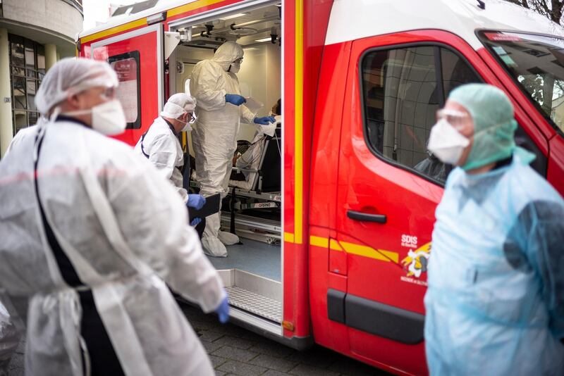 A man who called the rescue team for a respiratory distress is being treated Monday March 16, 2020 in Strasbourg, eastern France. For most people, the new coronavirus causes only mild or moderate symptoms. For some it can cause more severe illness. (AP Photo/Jean-Francois Badias)