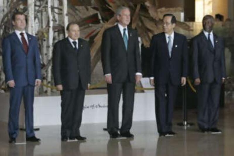 G8 and African leaders pose for a group photo. From left: the Russian president Dmitry Medvedev, the Algerian president Abdelaziz Bouteflika, the US president George Bush, the Japanese prime minister Yasuo Fukuda and the South African president Thabo Mbeki.