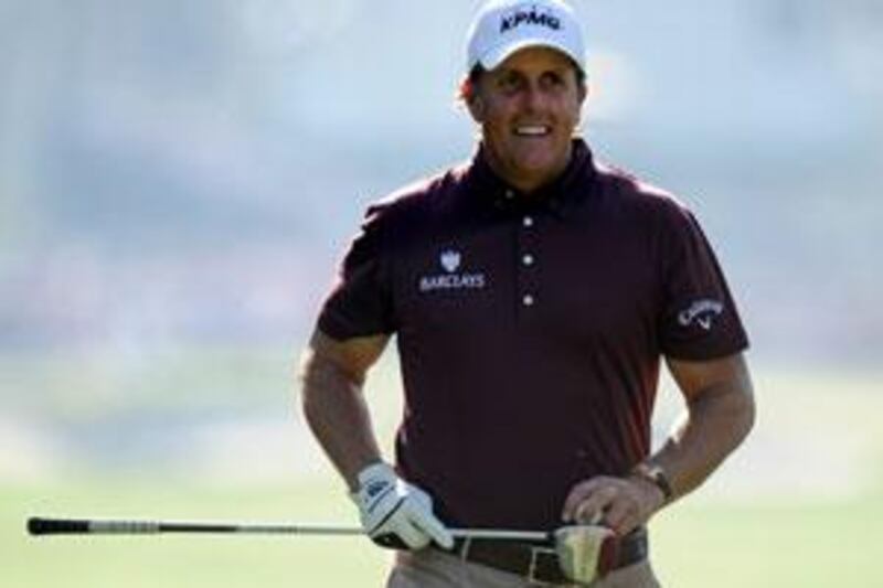 Phil Mickelson smiles during practice at Augusta.