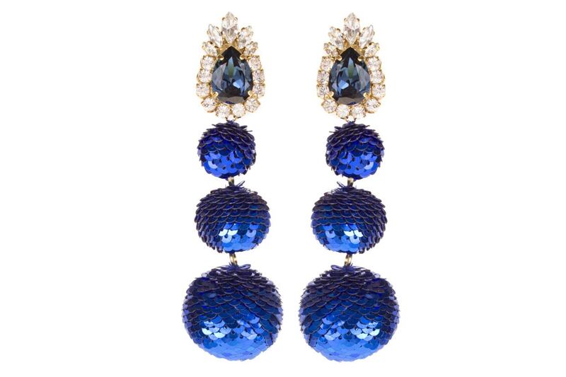 Earrings by Shourouk at S*uce Rocks. Costume jewellery is updated with the addition of baubles of Prussian blue sequins, to create extravagant dangles. Dressy enough for the evening, but also ideal for dramatic daywear.