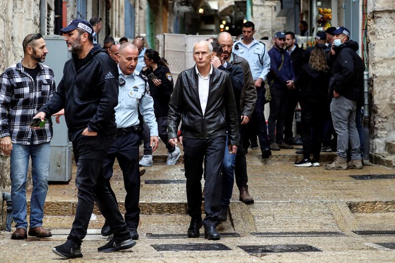Omer Bar-Lev, Israel's Minister of Public Security, centre, with Israeli police officers at the site.  Reuters