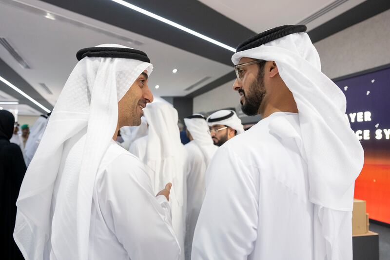 Sheikh Hamdan bin Mohamed, right, and Sheikh Zayed bin Hamdan tour the airshow.