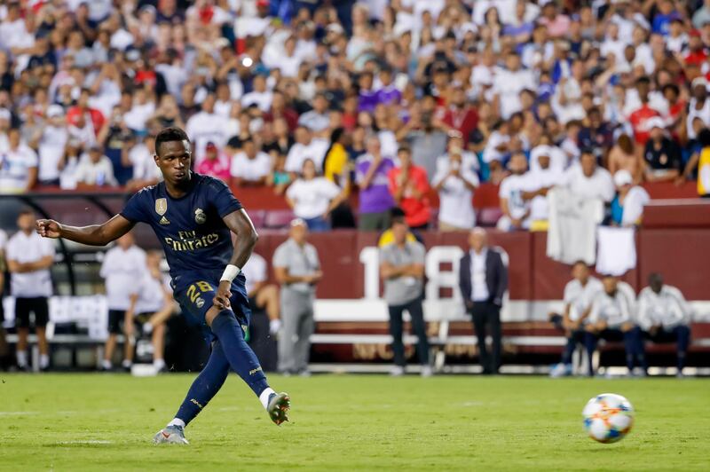 Real Madrid forward Vinicius Junior scores a penalty in the shoot-out. EPA