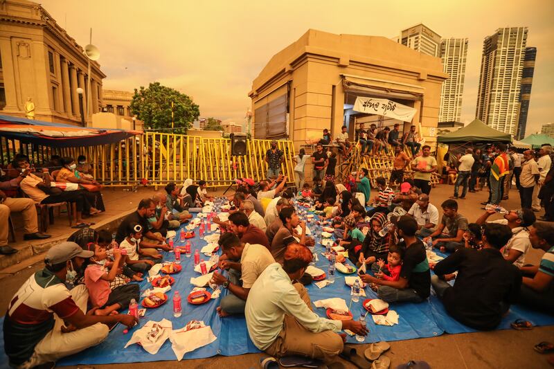 Muslim protesters gather to eat iftar in front of the president's secretariat in Colombo, Sri Lanka. EPA