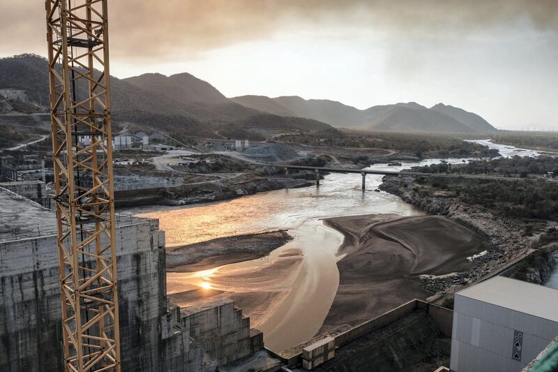 A general view of the Blue Nile river as it passes through the Grand Ethiopian Renaissance Dam (GERD),  near Guba in Ethiopia, on December 26, 2019. - The Grand Ethiopian Renaissance Dam, a 145-metre-high, 1.8-kilometre-long concrete colossus is set to become the largest hydropower plant in Africa.
Across Ethiopia, poor farmers and rich businessmen alike eagerly await the more than 6,000 megawatts of electricity officials say it will ultimately provide. 
Yet as thousands of workers toil day and night to finish the project, Ethiopian negotiators remain locked in talks over how the dam will affect downstream neighbours, principally Egypt. (Photo by EDUARDO SOTERAS / AFP)