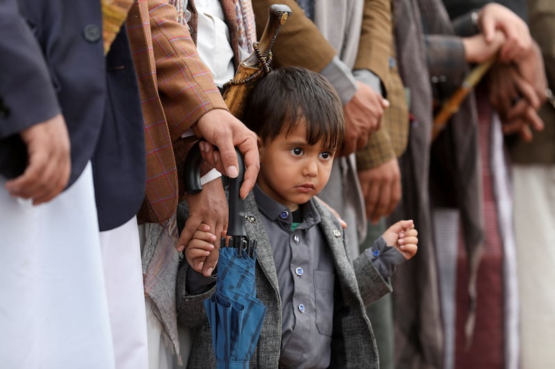 Relatives of freed prisoners wait at Sanaa Airport. Reuters