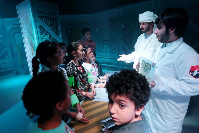 Children learn about space on the opening day of the Abu Dhabi Science Festival at Mushrif Central Park in Abu Dhabi. Christopher Pike / The National