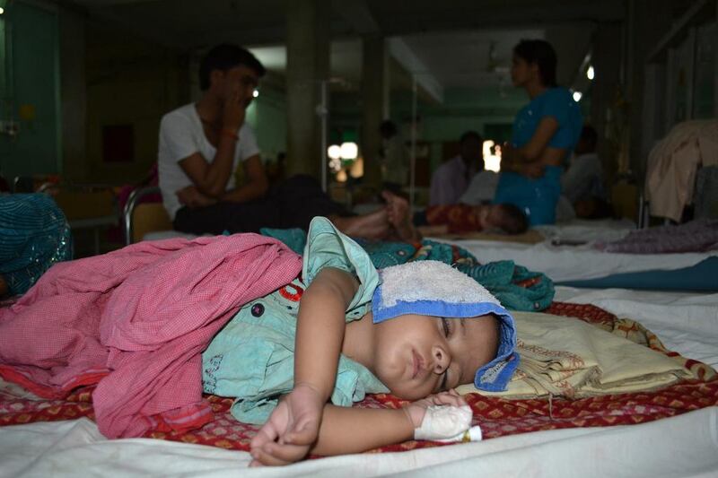 An Indian child suffering from encephalitis lies on a bed at The Baba Raghav Das Medical College in Gorakhpur, southeast of Lucknow. At least 350 children have died from encephalitis in Uttar Pradesh this year. AFP