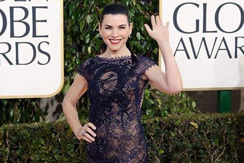 Julianna Margulies offsets a reeky low back with a high neck and cap sleeves. Jason Merritt / AFP
