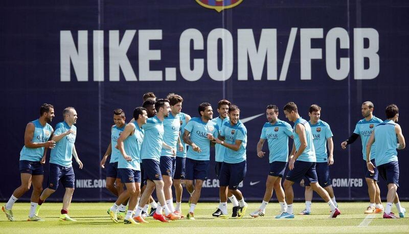 Barcelona players gathering during their training session at the Joan Gamper grounds near Barcelona on Friday as they prepare to take on Atletico Madrid for a chance to win the La Liga title on Saturday. Albert Gea / Reuters / May 16, 2014