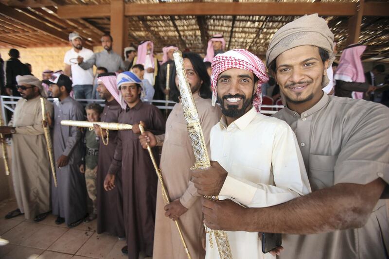 Swords are given to Jordanian Bedouins winners who raced camels using robotic jockeys at the Sheikh Zayed track in the town of al-Disi in the desert of Wadi Rum valley, on November 9, 2019. (The National)