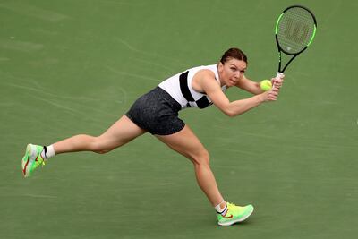 DUBAI, UNITED ARAB EMIRATES - FEBRUARY 19: Simona Halep of Romania plays a shot in her match against Eugenie Bouchard of Canada during day three of the WTA Dubai Duty Free Tennis Championships at Dubai Tennis Stadium on February 19, 2019 in Dubai, United Arab Emirates. (Photo by Francois Nel/Getty Images)