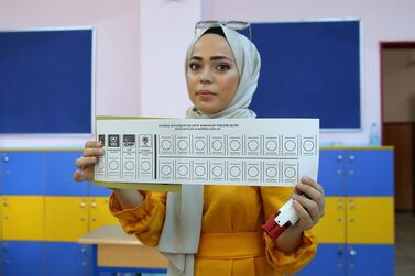 A woman shows a ballot paper at a polling station during the mayoral election re-run in Istanbul, Turkey. Reuters