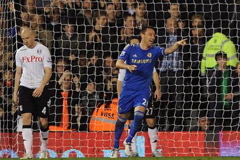 John Terry celebrates scoring Chelsea's third in the west London derby clash with Fulham.