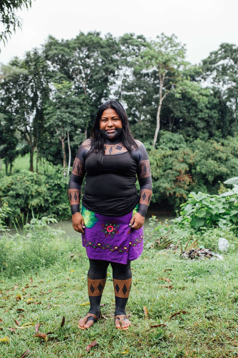 Sara Omi in her traditional dress with designs and body paint from the jagua fruit used by her community to decorate themselves before they go hunting or for spiritual ceremonies. Photo: TINTA