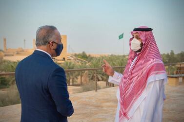 Saudi Arabia's Crown Prince Mohammed bin Salman and Iraqi Prime Minister Mustafa Al-Kadhimi, visit the historical city Ad Diriyah on the outskirts of Riyadh, Saudi Arabia March 31, 2021. Bandar Algaloud/Courtesy of Saudi Royal Court/Handout via REUTERS ATTENTION EDITORS - THIS PICTURE WAS PROVIDED BY A THIRD PARTY