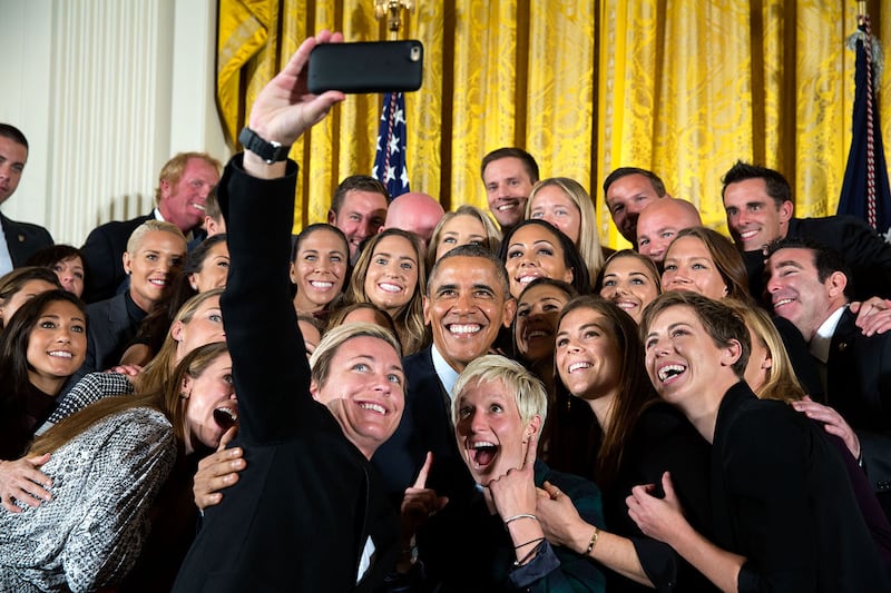 Mr Obama poses for a group selfie with the US Women's National Soccer Team celebrating their Fifa Women's World Cup victory at the White House on October 27, 2015. Photo: The National Archives