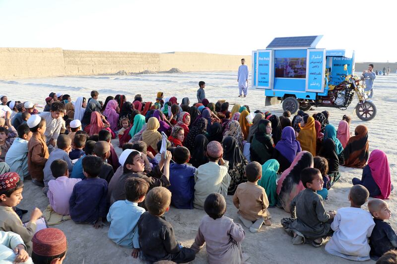 Afghan children attend an educational event organised by Pen Path, a civil society initiative providing education to Afghan children in areas where there is no school, in Kandahar, Afghanistan.