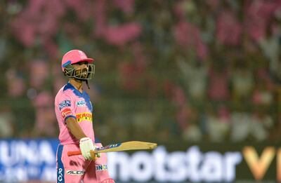 Rajasthan Royals cricketer Ajinkya Rahane celebrates after he completes his century (100 runs)during the 2019 Indian Premier League (IPL) Twenty20 cricket match between Delhi Capitals and Rajasthan Royals at the Sawai Mansingh Stadium in Jaipur on April 22, 2019. (Photo by Sajjad HUSSAIN / AFP) / ----IMAGE RESTRICTED TO EDITORIAL USE - STRICTLY NO COMMERCIAL USE-----