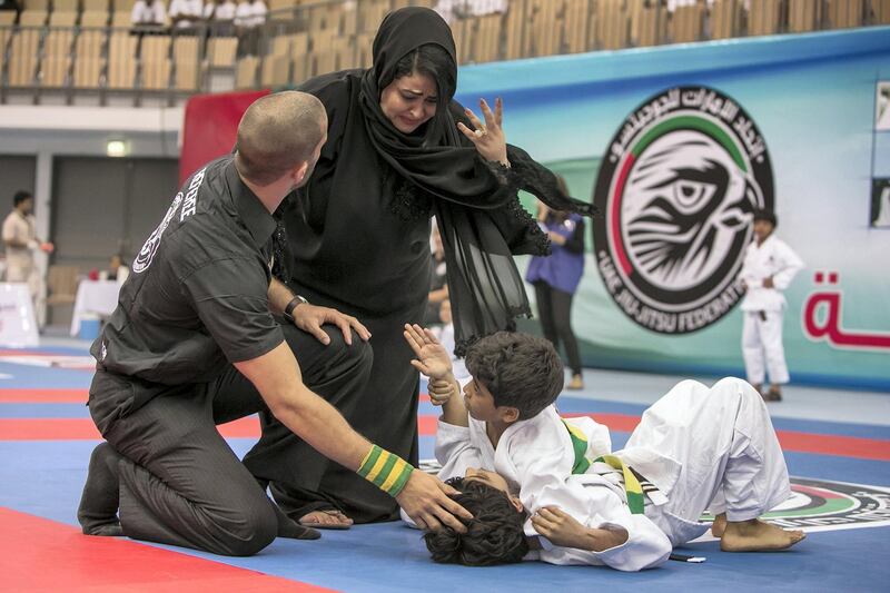 ABU DHABI, UNITED ARAB EMIRATES, Feb.5, 2014:   
Amani al Hashemi reacts as she rushes to check on her son, Nahian Abdalla Rashid, 11, (bottom) after she thought he got hurt during a fight at the Abu Dhabi Jiu-Jitsu Cup Kids 2014 on Wednesday, Feb. 5, 2014, at the new indoor sports hall, the FGB Arena, at the Zayed Sports City in Abu Dhabi. (Silvia Razgova / The National)

Reporter: standalone
Section: National, Sport
Usage: Feb. 6, 2014

ABU DHABI, UNITED ARAB EMIRATES, Feb.5, 2014:   
Abu Dhabi Jiu-Jitsu Cup Kids 2014 on Wednesday, Feb. 5, 2014, at the new indoor sports hall, the FGB Arena, at the  Zayed Sports City in Abu Dhabi.  (Silvia Razgova / The National)

Reporter: standalone
Section: National, Sport
Usage: Feb. 6, 2014

