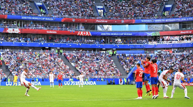 Serbia's Aleksandar Kolarov scores the only goal from a free kick. Dylan Martinez / Reuters