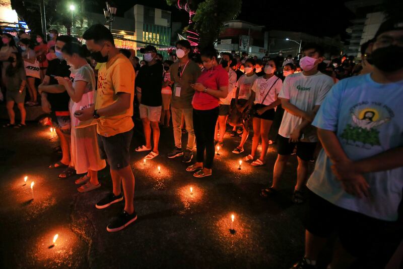 Supporters of Ms Robredo take a part in a prayer vigil. AFP