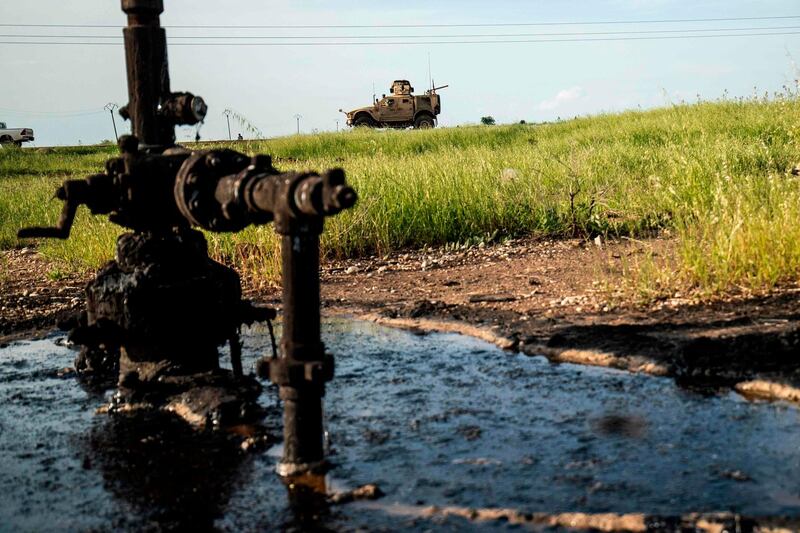 A US military vehicle patrols the oil fields in the town of Qahtaniyah in Syria's northeastern Hasakeh province near the Turkish border, on May 8. Delil Souleiman / AFP