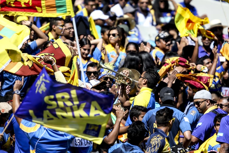 A Sri Lankan papare band play the trumpet as fans cheer during the 2015 ICC Cricket World Cup Pool A group match between Sri Lanka and Bangladesh at the Melbourne Cricket Ground in Australia in 2015. Shutterstock