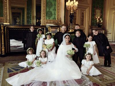 Prince George and Princess Charlotte pose with the happy couple and the rest of the young bridal party