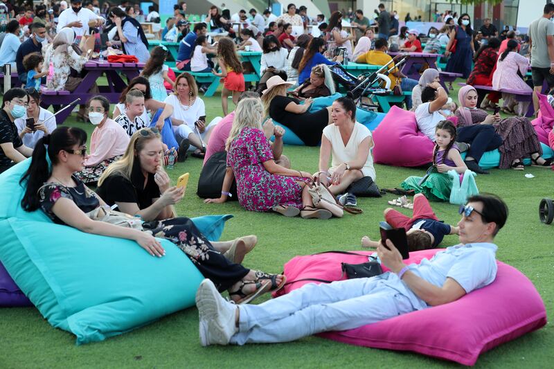 Visitors enjoy the relaxed atmosphere at Ain Dubai