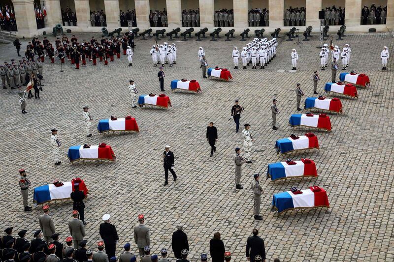 French President Emmanuel Macron attends a tribute ceremony at the Invalides monument, in Paris, for the 13 French soldiers killed in Mali.  AFP