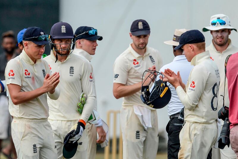 England's cricketers leave the ground after the second day of a four-day practice match between Sri Lanka Board President's XI and England at the P. Sara Oval Cricket Stadium in Colombo on March 13, 2020. England's cricket team abruptly pulled out of a tour of Sri Lanka on March 13 over the mounting coronavirus pandemic. A practice match in Colombo was halted as the team announced they would be flying back to London, and the first of two Test matches due to start on March 19 has been postponed. / AFP / LAKRUWAN WANNIARACHCHI
