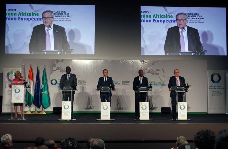 President of the European Commission Jean-Claude Juncker talks next to Guinea's President and President of the African Union Alpha Conde, European Council President Donald Tusk and African Union Commission President Moussa Faki Mahamat during a news conference at the closing session of the 5th African Union - European Union (AU-EU) summit in Abidjan, Ivory Coast November 30, 2017. REUTERS/Luc Gnago