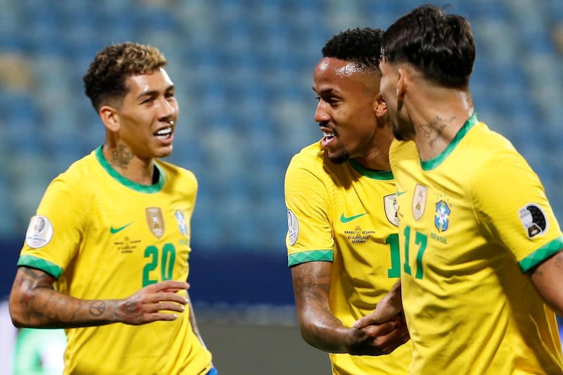 Brazil's Eder Militao (C) celebrates with his teammates after scoring against Ecuador. EPA