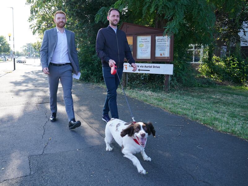 Mr Beales, left, Labour candidate for Uxbridge and South Ruislip, after casting his vote in the constituency. PA