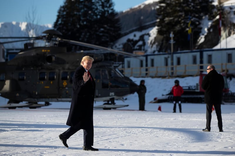 US President Donald Trump waves as he arrives in Davos, Switzerland on Marine One. AP Photo