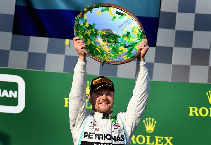 MELBOURNE, AUSTRALIA - MARCH 17:  Race winner Valtteri Bottas of Finland and Mercedes GP celebrates on the podium  during the F1 Grand Prix of Australia at Melbourne Grand Prix Circuit on March 17, 2019 in Melbourne, Australia.  (Photo by Clive Mason/Getty Images)