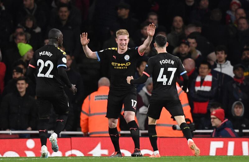 Manchester City's Kevin de Bruyne, centre, after scoring against Arsenal. EPA