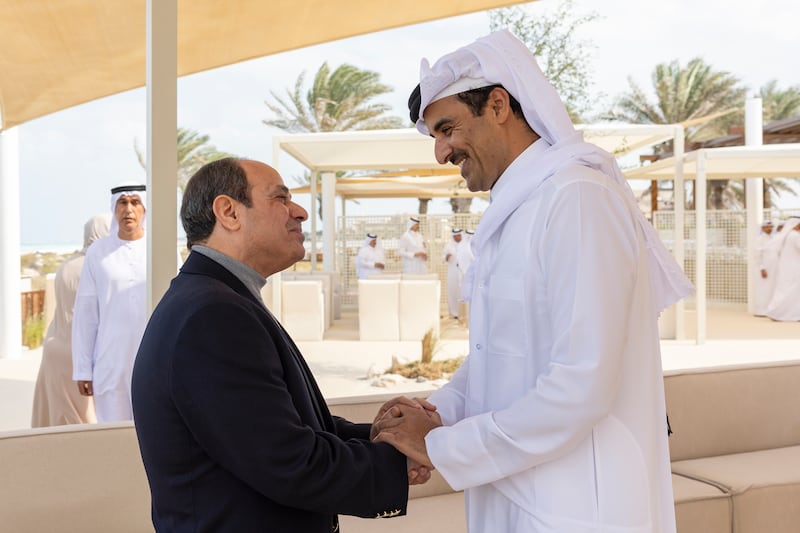 Qatari emir Sheikh Tamim greets President Abdel Fattah El Sisi in Abu Dhabi last month. Photo: Ryan Carter / Presidential Court