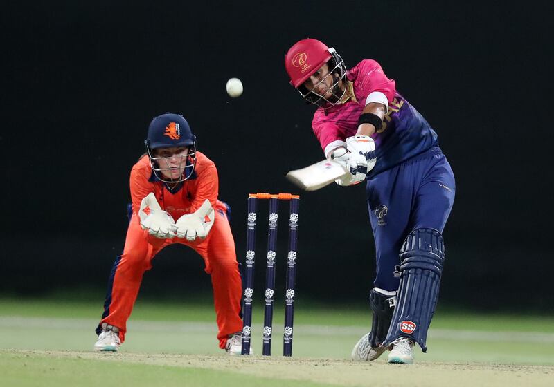 Esha Oza hits a boundary for the UAE on the way to a 10-wicket demolition of the Netherlands in the Women's T20 World Cup Qualifier at Zayed Cricket Stadium in Abu Dhabi on April 29, 2024. All images by Chris Whiteoak / The National